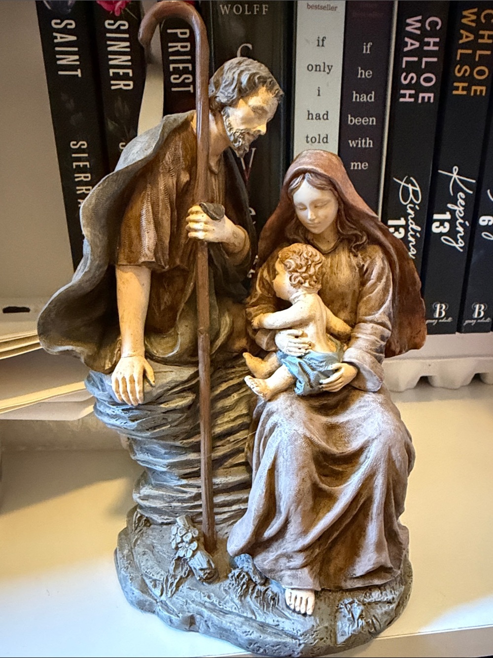 Joseph and Mary holding baby Jesus.